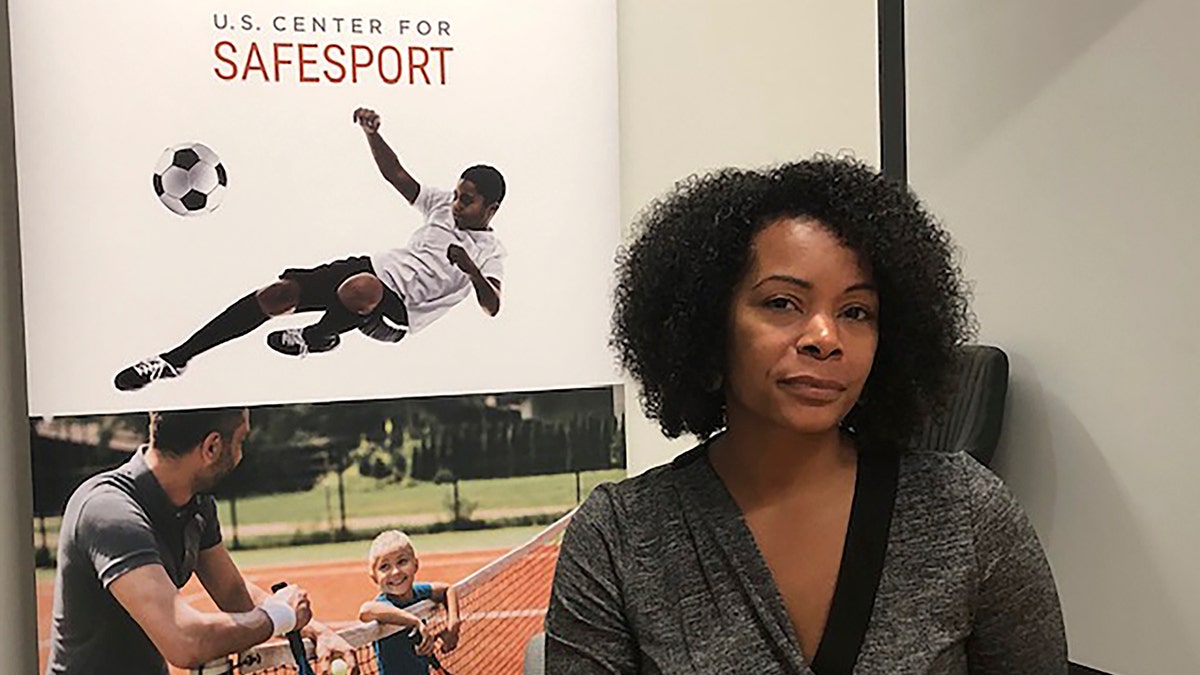 Ju'Riese Colon, the CEO for the U.S. Center for SafeSport, talks about the challenges facing her organization at their headquarters in Denver. (AP Photo/Eddie Pells)