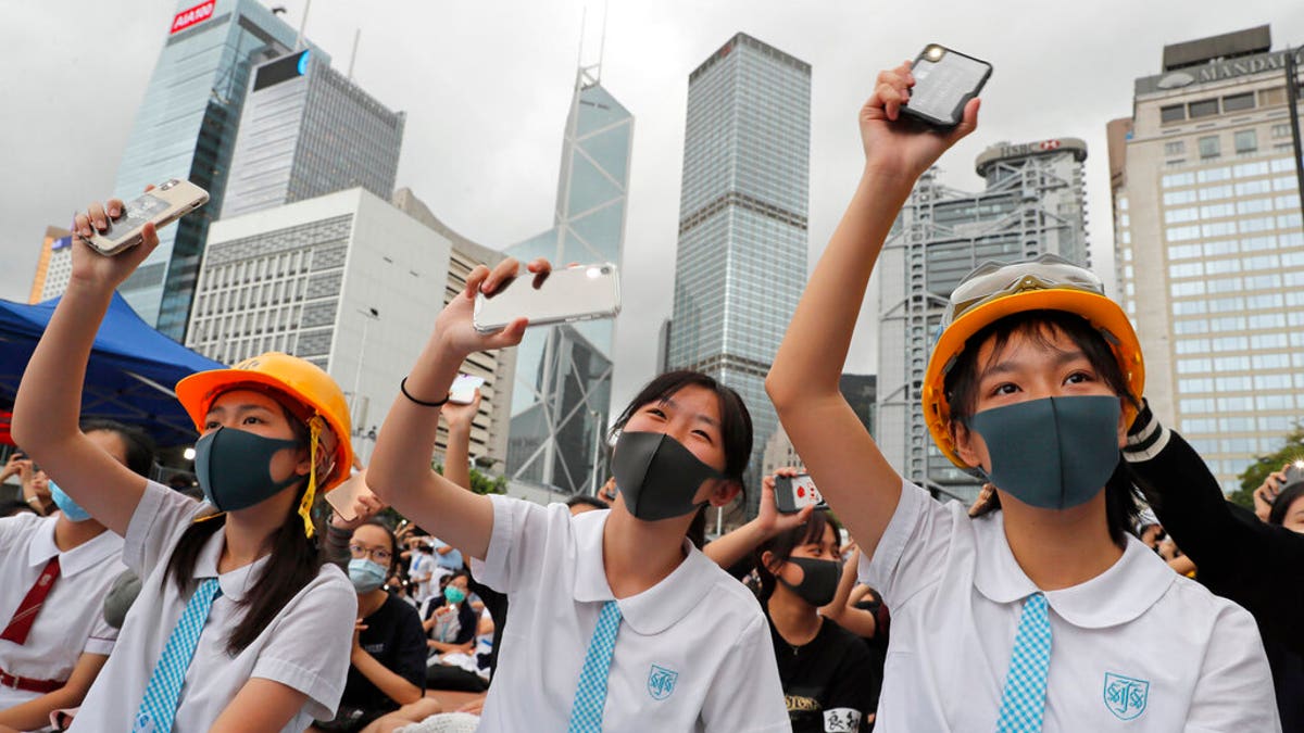 Students wear protective gear during a protest in Hong Kong, Monday, Sept. 2.