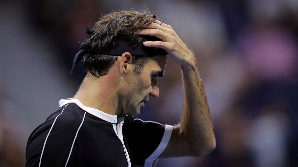 Roger Federer, of Switzerland, reacts after losing a point to Grigor Dimitrov, of Bulgaria, during the quarterfinals of the U.S. Open tennis tournament Tuesday, Sept. 3, 2019, in New York. (AP Photo/Charles Krupa)