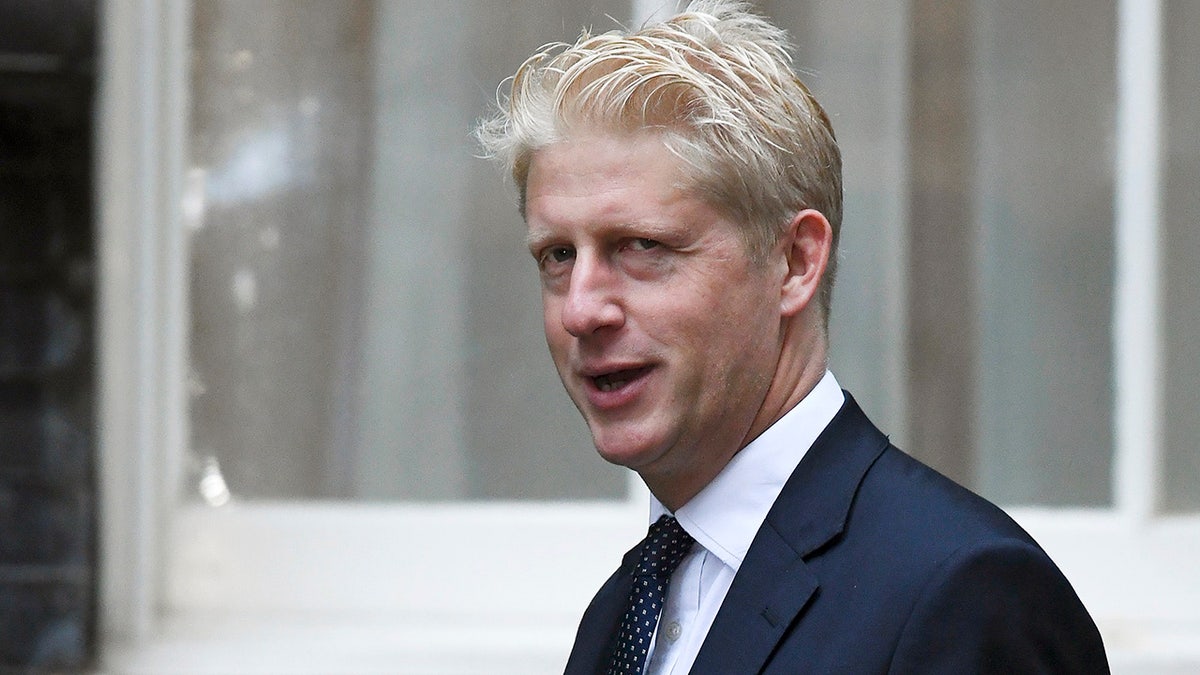 FILE - In this Wednesday, Sept. 4, 2019 file photo, Britain's Conservative Party lawmaker Jo Johnson arrives at Downing Street in London. Jo Johnson has announced he is quitting as an education minister and will step down from Parliament, saying he is “torn between family loyalty and the national interest.” (AP Photo/Alberto Pezzali, File)