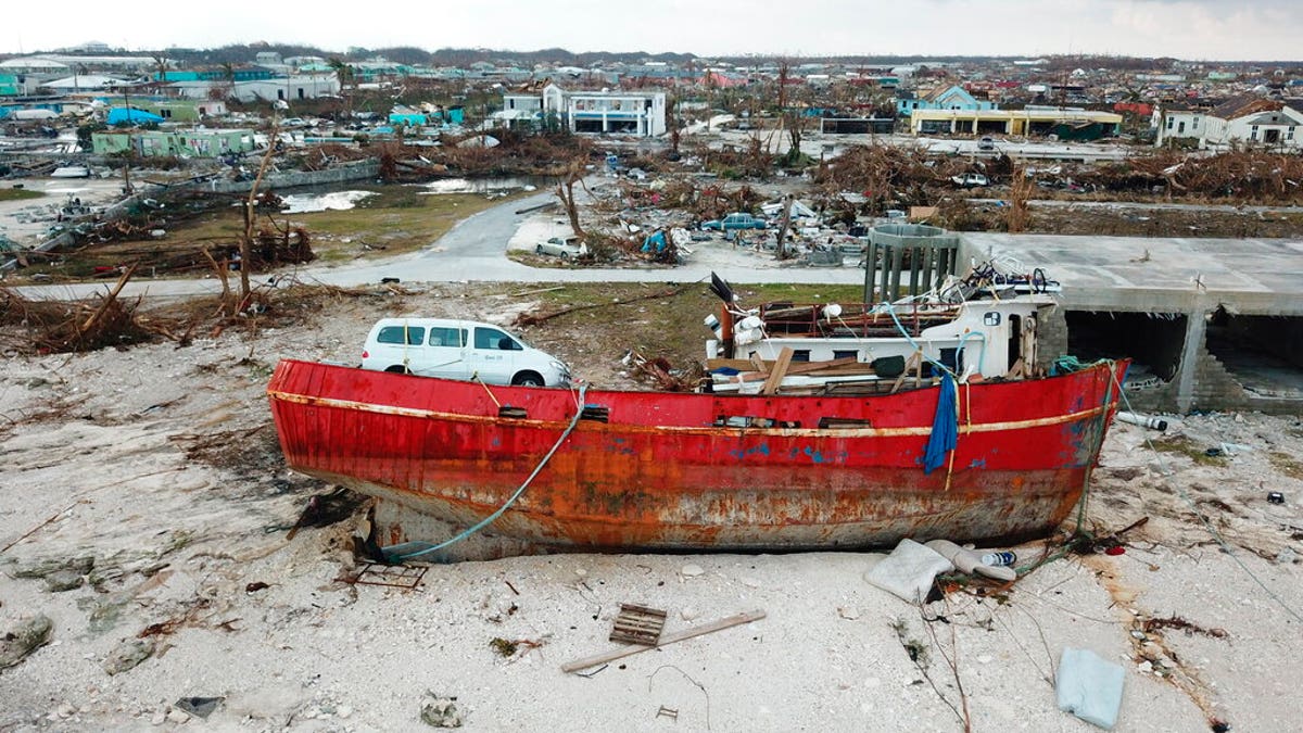 A boat sits grounded in the aftermath of Hurricane Dorian, in Marsh Harbor, Abaco Island, Bahamas, Friday, Sept. 6, 2019.