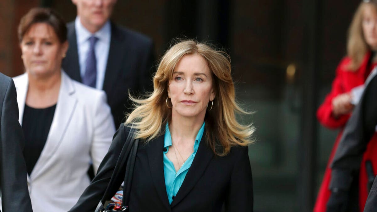 In April, Felicity Huffman departs federal court in Boston after facing charges in a nationwide college admissions bribery scandal.  (AP Photos/Charles Krupa, File)