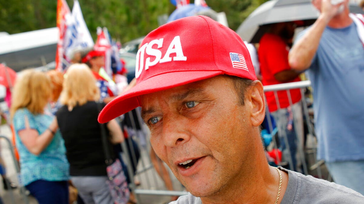 Dilber Jimenez from Raleigh, N.C., talks about why he supports President Donald Trump before a campaign rally in Fayetteville, N.C., Monday Sept. 9, 2019 (AP Photo/Chris Seward)