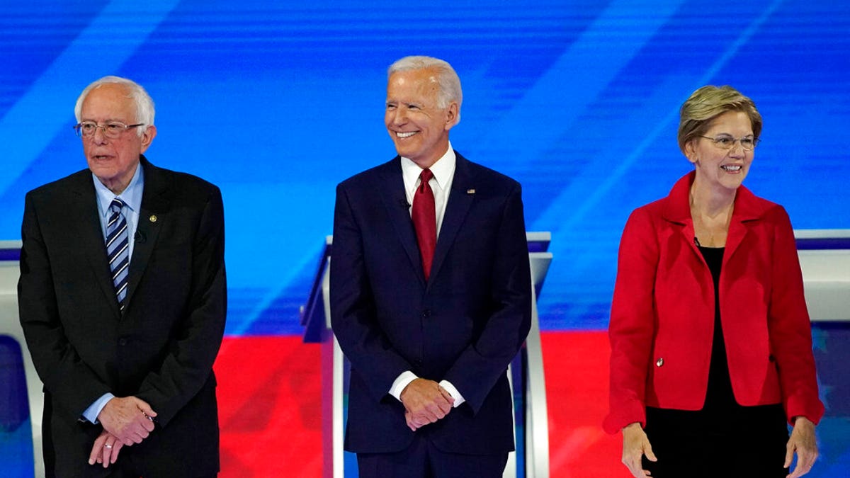 From left, presidential candidates Sen. Bernie Sanders, I-Vt., former Vice President Joe Biden and Sen. Elizabeth Warren, D-Mass., are introduced Thursday, Sept. 12, 2019, before a Democratic presidential primary debate hosted by ABC at Texas Southern University in Houston. (Associated Press)