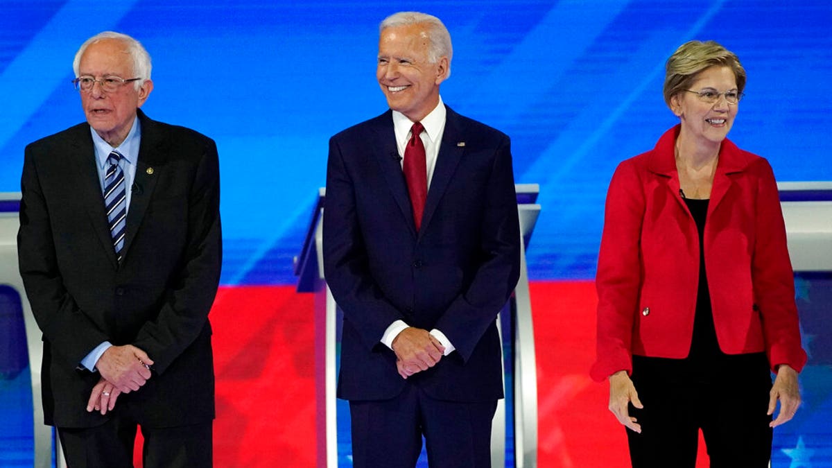 From left, presidential candidates Sen. Bernie Sanders, I-Vt., former Vice President Joe Biden and Sen. Elizabeth Warren, D-Mass., are introduced Thursday, Sept. 12, 2019, before a Democratic presidential primary debate hosted by ABC at Texas Southern University in Houston. (Associated Press)