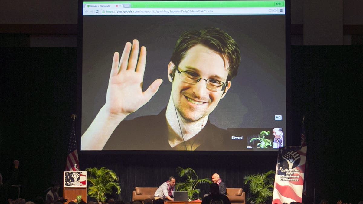 Edward Snowden appears on a live video feed broadcast from Moscow at an event sponsored by ACLU Hawaii in Honolulu, on Feb. 14, 2015. (AP Photo/Marco Garcia, File)