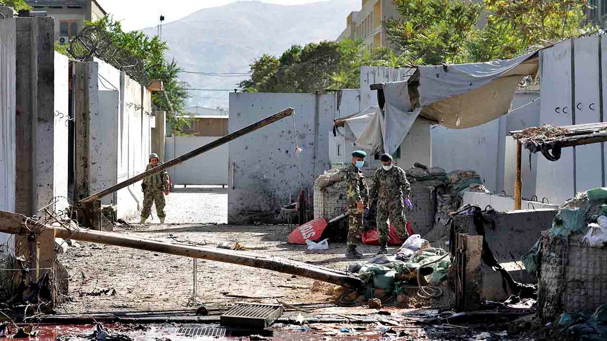 Afghan security forces work at the site of a suicide attack near the U.S. Embassy in Kabul, Afghanistan, Tuesday, Sept. 17, 2019. (AP Photo/Ebrahim Noroozi)