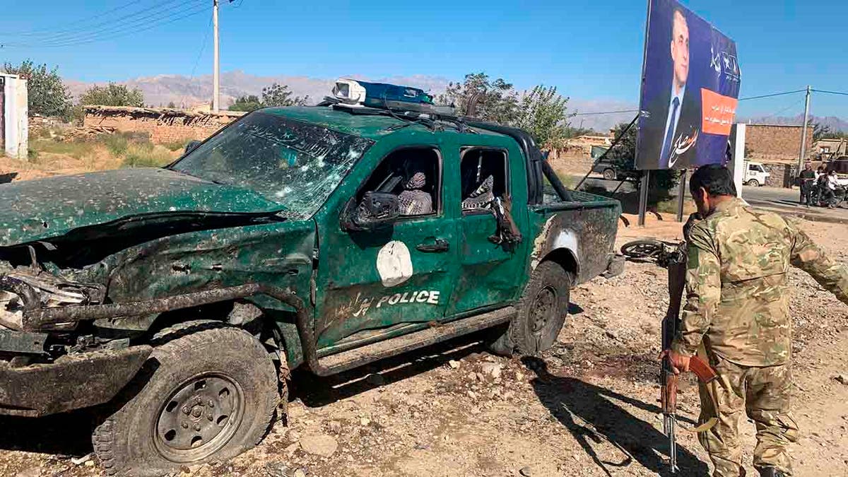 Afghan police inspect the site of a suicide attack, in Parwan province of Afghanistan, Tuesday, Sept. 17, 2019. 