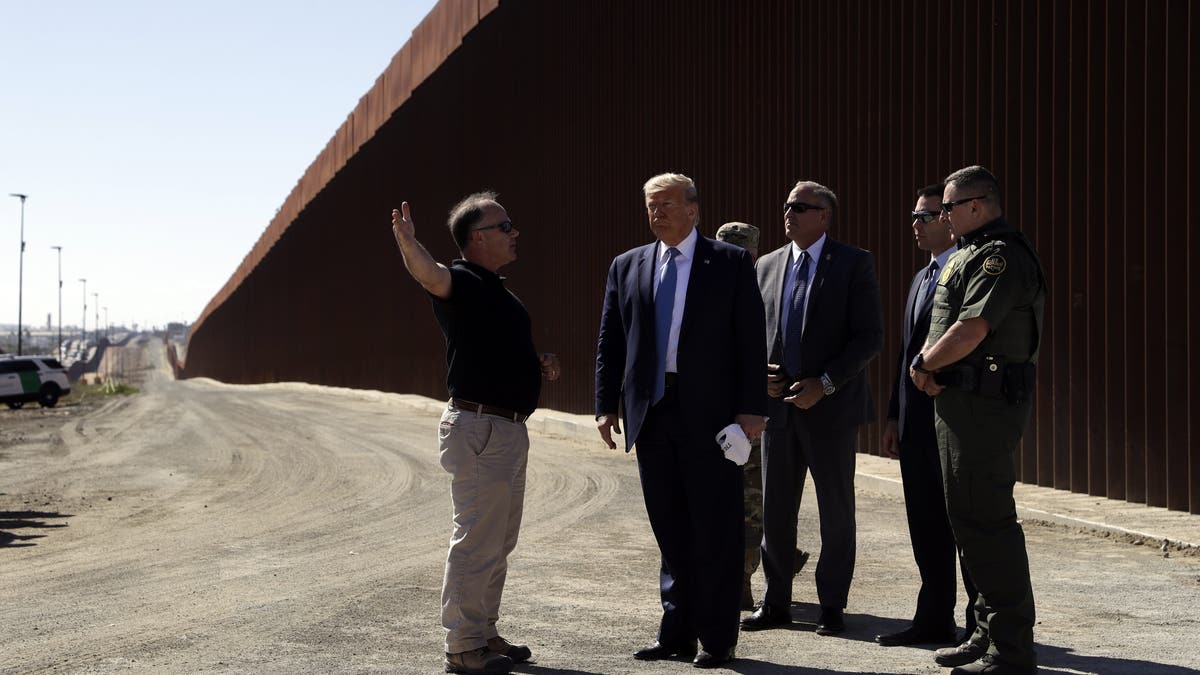 President Donald Trump tours a section of the southern border wall, Wednesday, Sept. 18, 2019, in Otay Mesa, Calif. (Associated Press)
