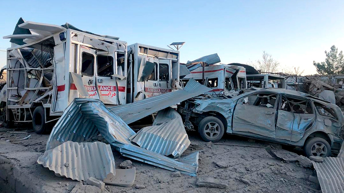 Damaged cars are seen at the site of a suicide attack in Zabul, Afghanistan, Thursday, Sept. 19, 2019. A powerful early morning suicide truck bomb devastated a hospital in southern Afghanistan on Thursday. (AP Photo/Ahmad Wali Sarhadi)