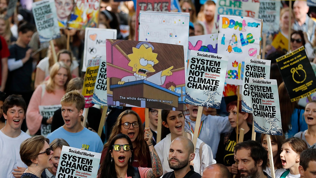 Climate protesters demonstrate in London, Friday, Sept. 20, 2019. Protesters around the world joined rallies on Friday as a day of worldwide demonstrations calling for action against climate change began ahead of a U.N. summit in New York. 