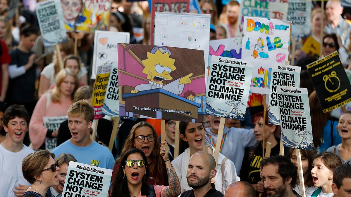 Climate protesters demonstrate in London, Friday, Sept. 20, 2019. Protesters around the world joined rallies on Friday as a day of worldwide demonstrations calling for action against climate change began ahead of a U.N. summit in New York.