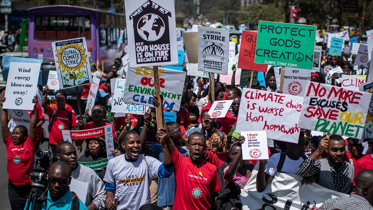 Around a thousand protesters march to demand action on climate change, in the streets of downtown Nairobi, Kenya Friday, Sept. 20, 2019. Protesters around the world joined rallies on Friday as a day of worldwide demonstrations calling for action against climate change began ahead of a U.N. summit in New York.