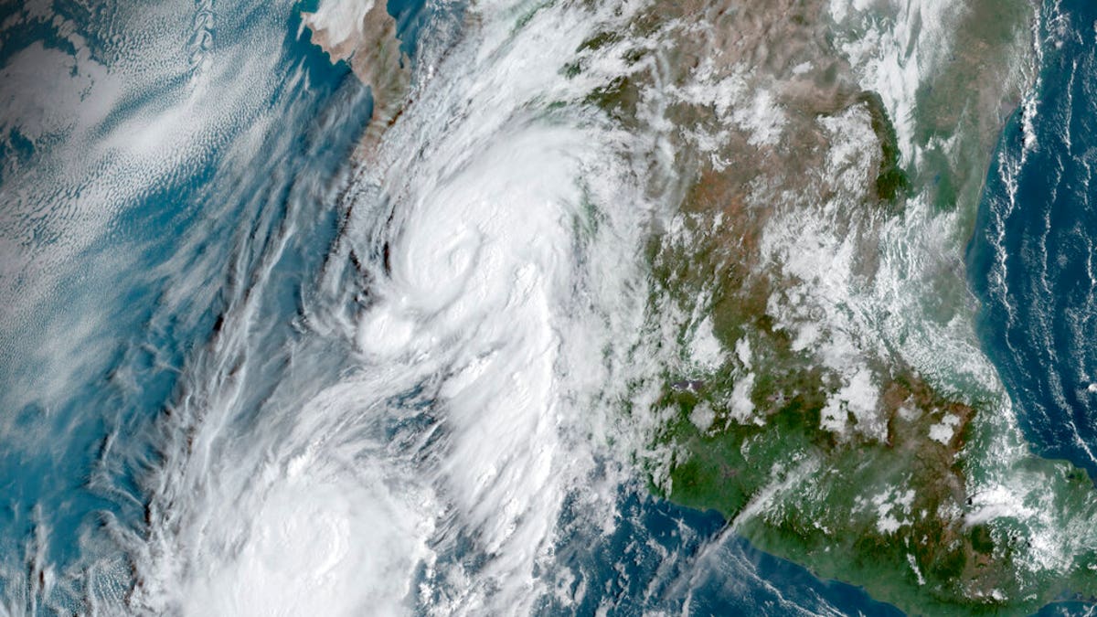 This GOES-16, GeoColor satellite image taken Friday, Sept. 20, 2019, at 14:50 UTC and provided by National Oceanic and Atmospheric Administration (NOAA), shows Hurricane Lorena, top center, followed by Tropical Storm Mario, near the southern tip of Mexico’s Baja California peninsula.