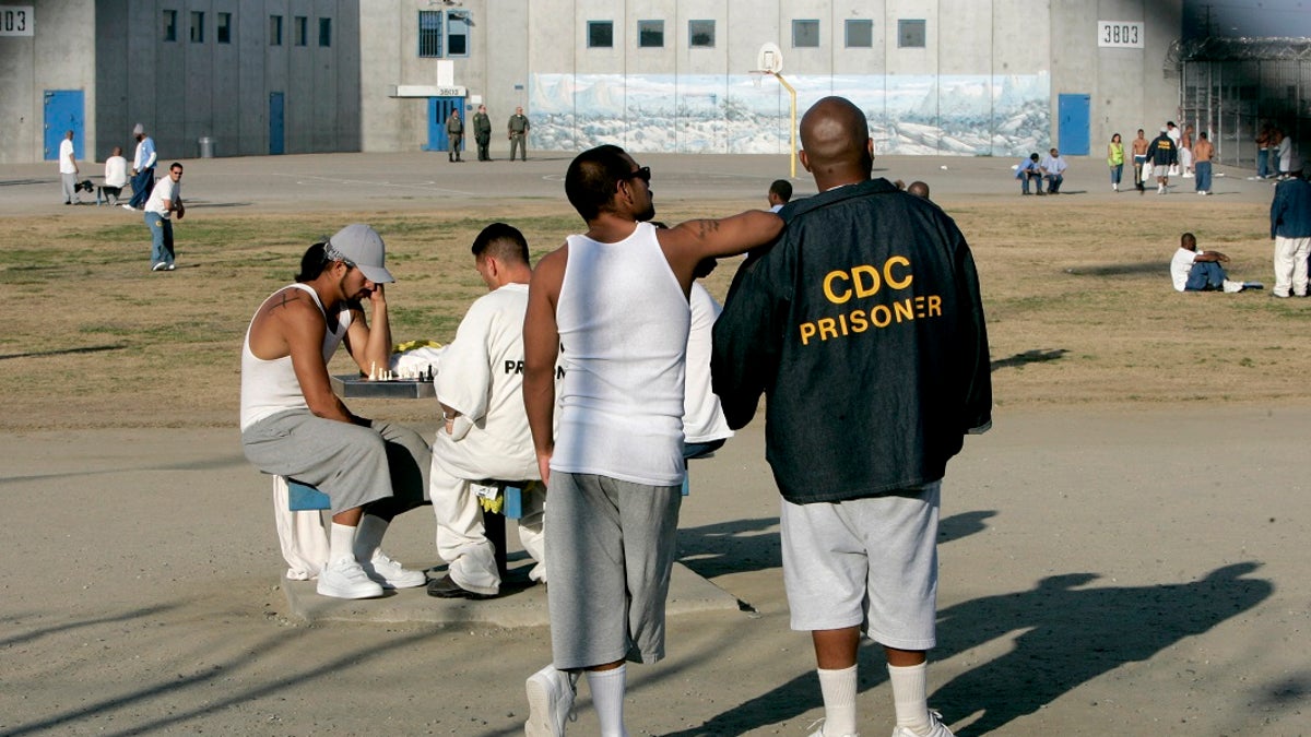 In this Jan. 14, 2009 file photo inmates use the recreation yard at Corcoran State Prison. (AP Photo/Rich Pedroncelli, File )