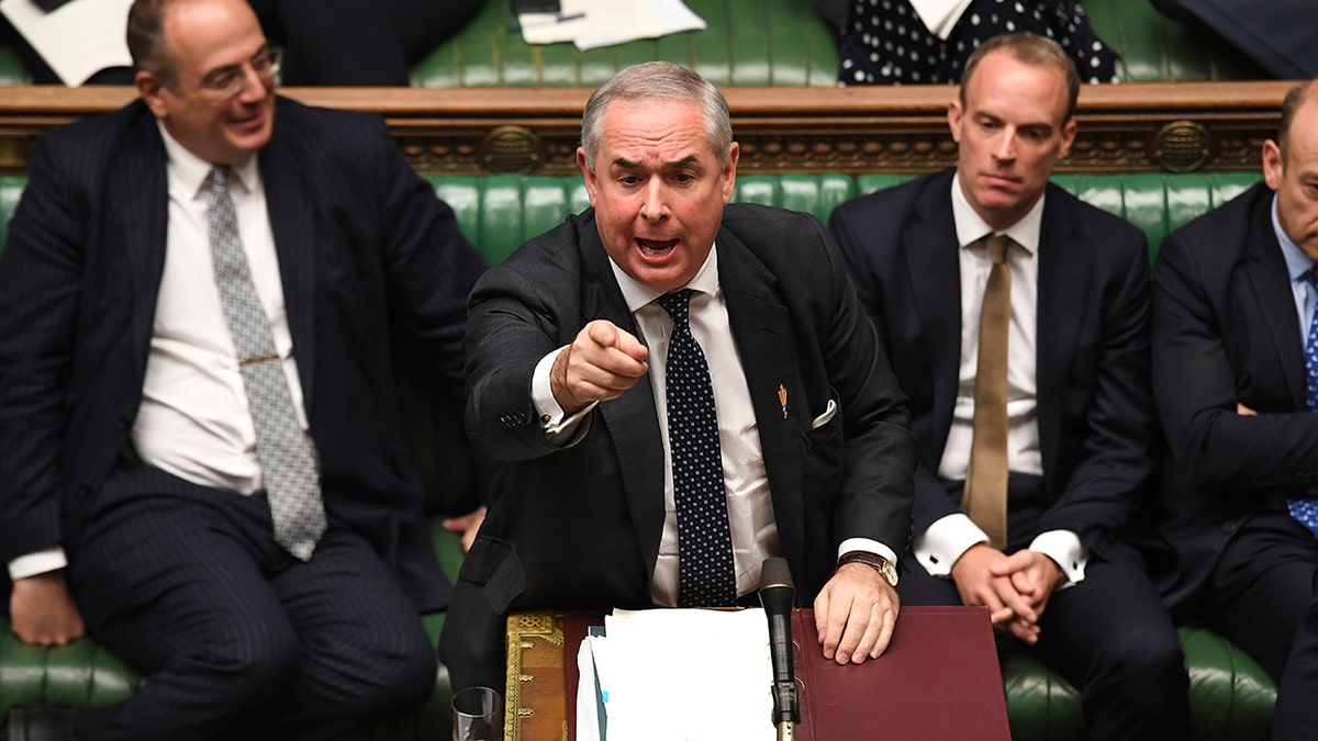 In this handout photo provided by the House of Commons, Britain's General Attorney Geoffrey Cox speaks in Parliament in London, Wednesday, Sept. 25, 2019. (Jessica Taylor/House of Commons via AP)