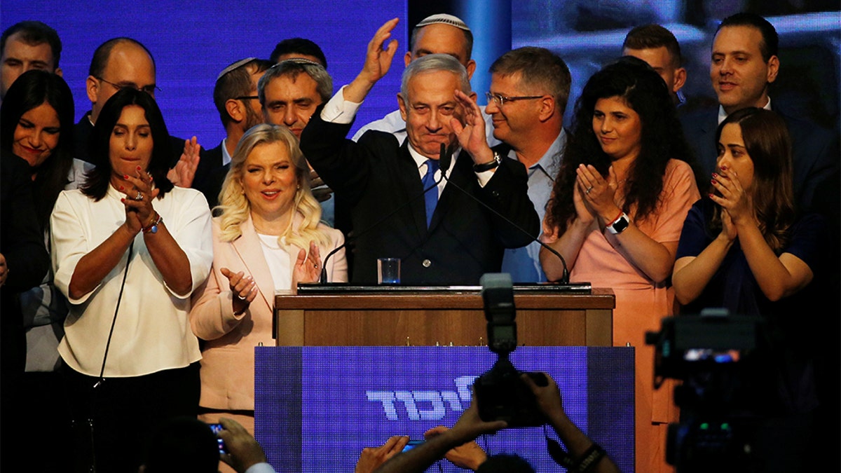 Israeli Prime Minister Benjamin Netanyahu gesturing to supporters at his Likud party headquarters early Wednesday.