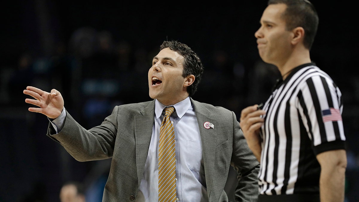 FILE - In this March 12, 2019, file photo, Georgia Tech head coach Josh Pastner, left, directs his team against Notre Dame during the first half of an NCAA college basketball game in the Atlantic Coast Conference tournament, in Charlotte, N.C.  (AP Photo/Nell Redmond, File)