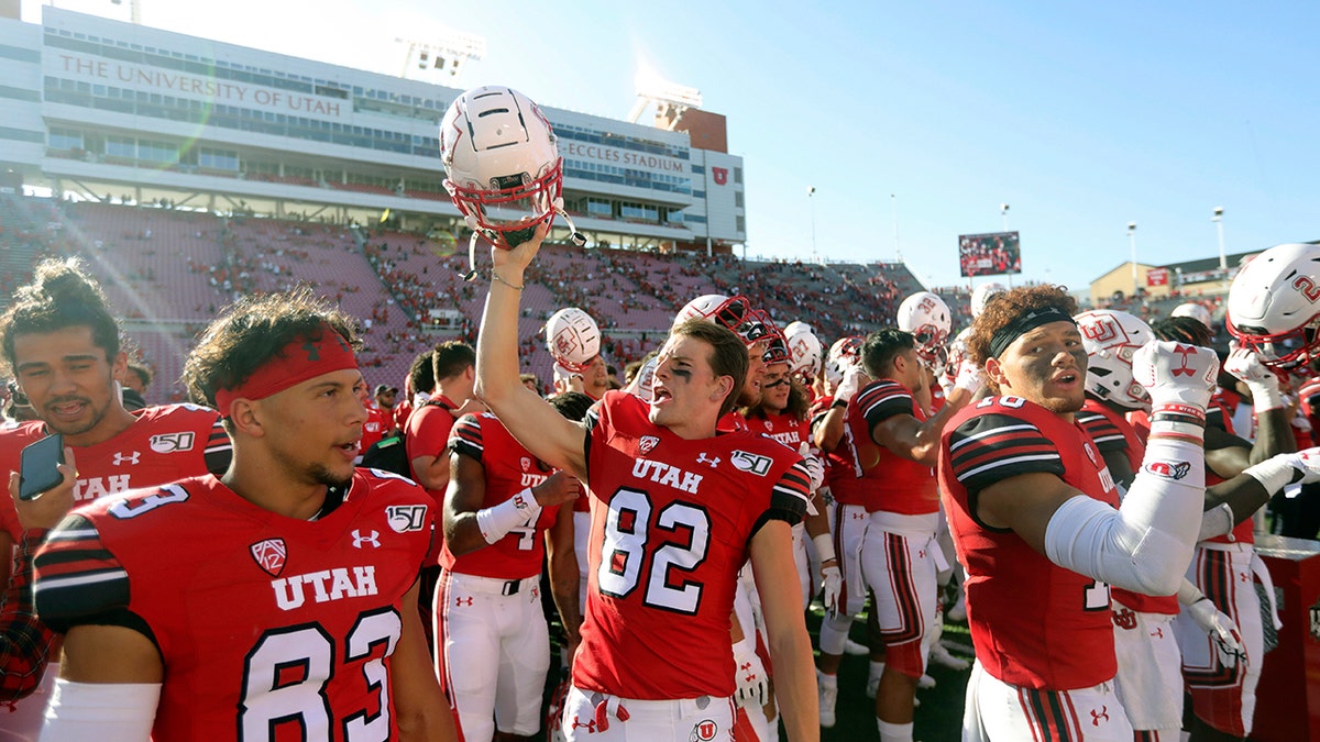 Utah wide receiver Dylan Slavens (82) celebrates with his teammate following their victory over Idaho State during an NCAA college football game Saturday, Sept. 14, 2019, in Salt Lake City. (AP Photo/Rick Bowmer)