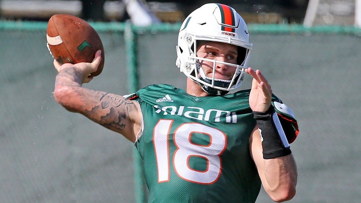 FILE - In this Aug. 7, 2019, file photo, Miami quarterback Tate Martell (18) throws the ball during an NCAA college football practice in Coral Gables, Fla. (Charles Trainor Jr./Miami Herald via AP, File)