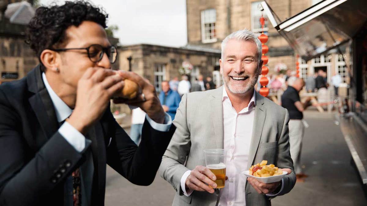 Expensive suits and sloppy street food? Bold choice, gentlemen!