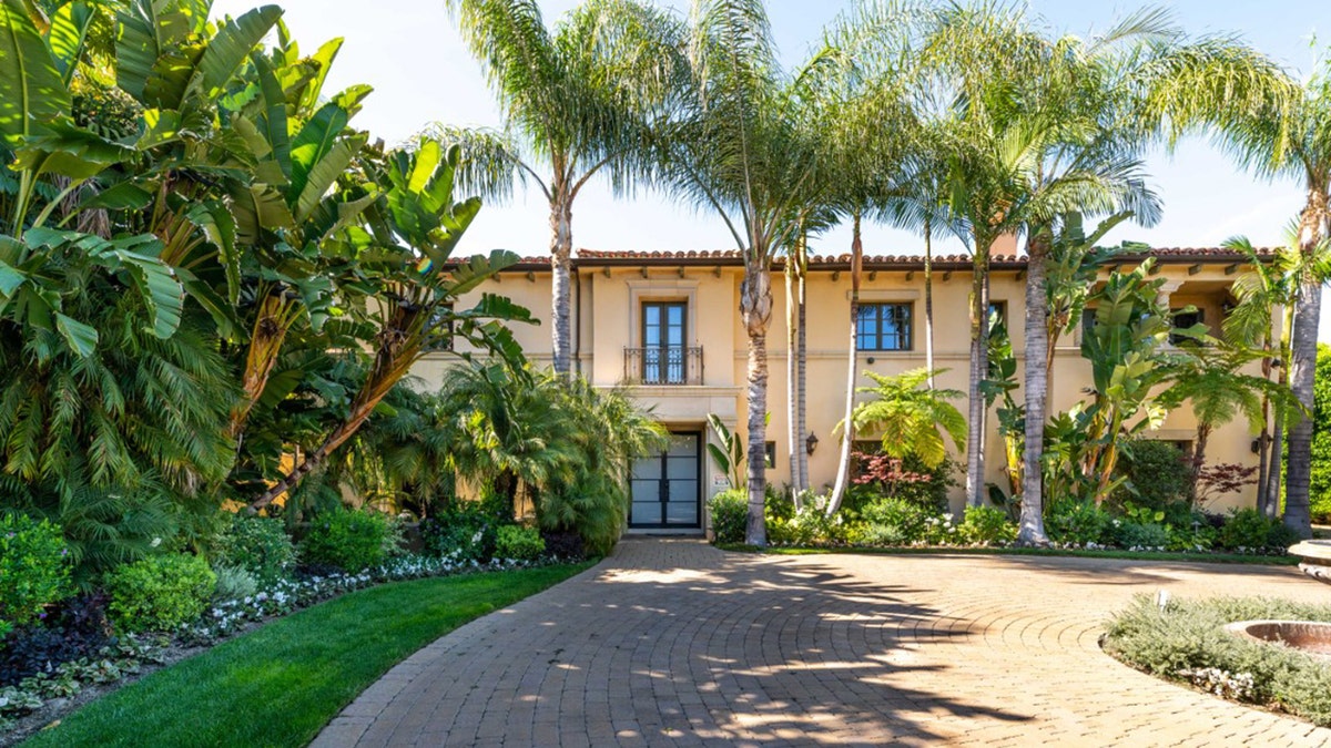 The villa-style home, which is "guard gated" in a “unique, prestigious” location, measures nearly 8,000 square feet and sits on 0.75 acres.