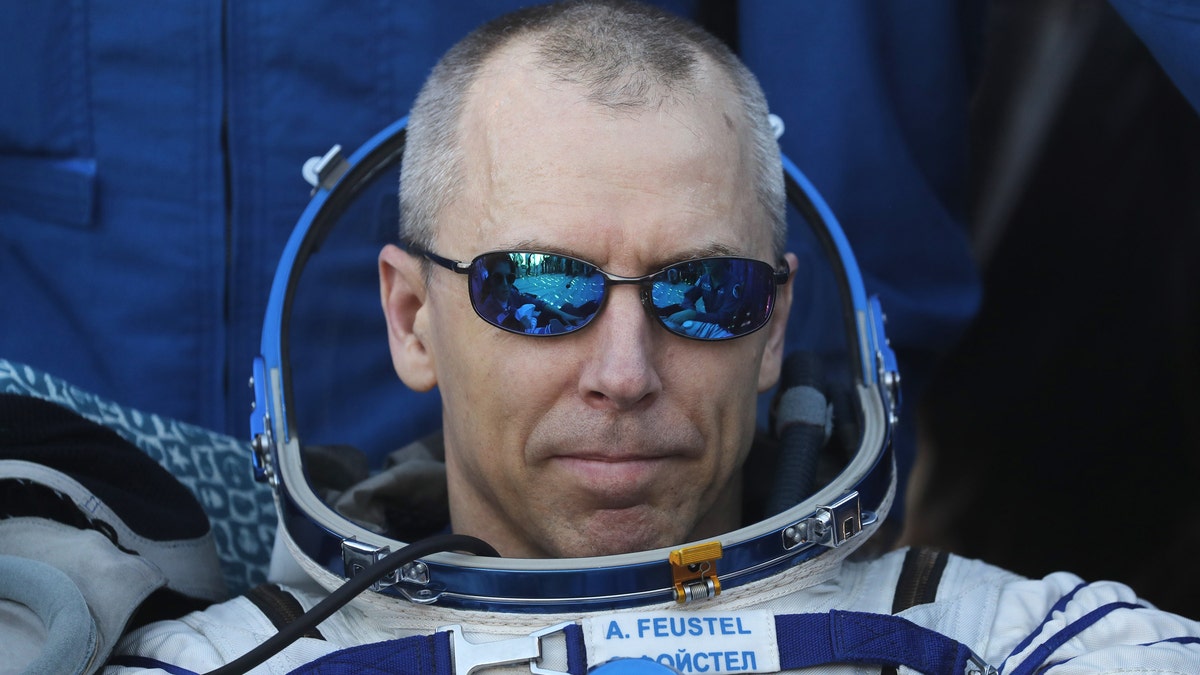 NASA astronaut Andrew Feustel rests in a chair shortly after landing in a remote area outside the town of Dzhezkazgan (Zhezkazgan), Kazakhstan, on Oct. 4, 2018.