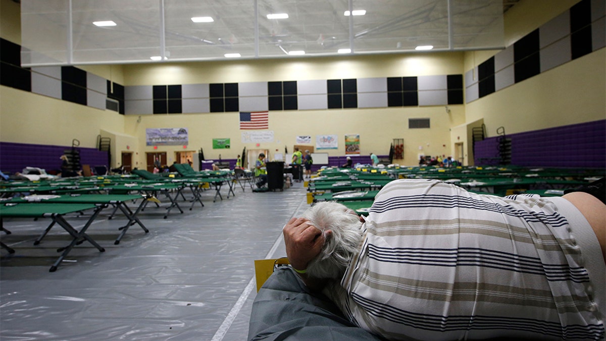 An evacuee on a cot at a shelter for people with special needs on Sunday in Stuart, Fla., ahead of Hurricane Dorian.