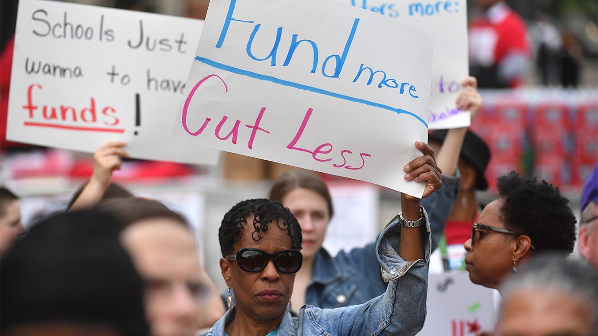 WASHINGTON, DC  APRIL 25:   Teachers, students, and members of the Teachers Union gather and rally against budget cuts and under funding of District of Columbia Public Schools at Freedom Plaza  in Washington, DC on April 25, 2019 (Photo by Marvin Joseph/The Washington Post via Getty Images)