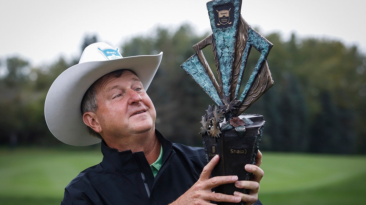 Wes Short Jr., of Austin, Texas, celebrates winning the PGA Tour Champion's Shaw Charity Classic golf event in Calgary, Alberta, Sunday, Sept. 1, 2019. (Jeff McIntosh/The Canadian Press via AP)
