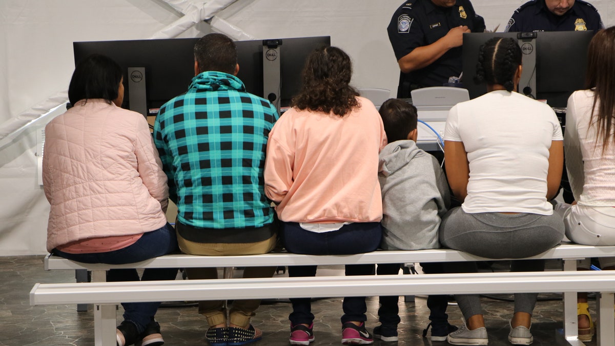 Migrants wait in a processing room in a Migrant Protection Protocol (MPP) center in Laredo, Texas. (Adam Shaw/Fox News)