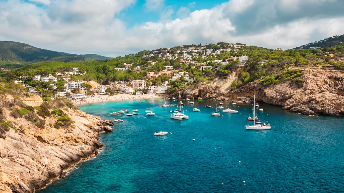 Aerial view of the cliffs and the beach of Cala Vadella, Ibiza, Spain
