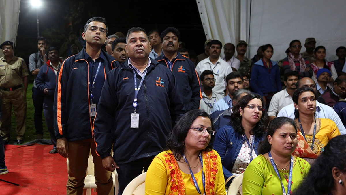 Indian Space Research Organization (ISRO) employees react as they listen to an announcement by organizations's chief Kailasavadivoo Sivan at its Telemetry, Tracking and Command Network facility in Bangalore, India, Saturday, Sept. 7, 2019. India's space agency said it lost touch Saturday with its Vikram lunar lander as it aimed to land on the south pole of the moon and deploy a rover to search for signs of water. (AP Photo/Aijaz Rahi)