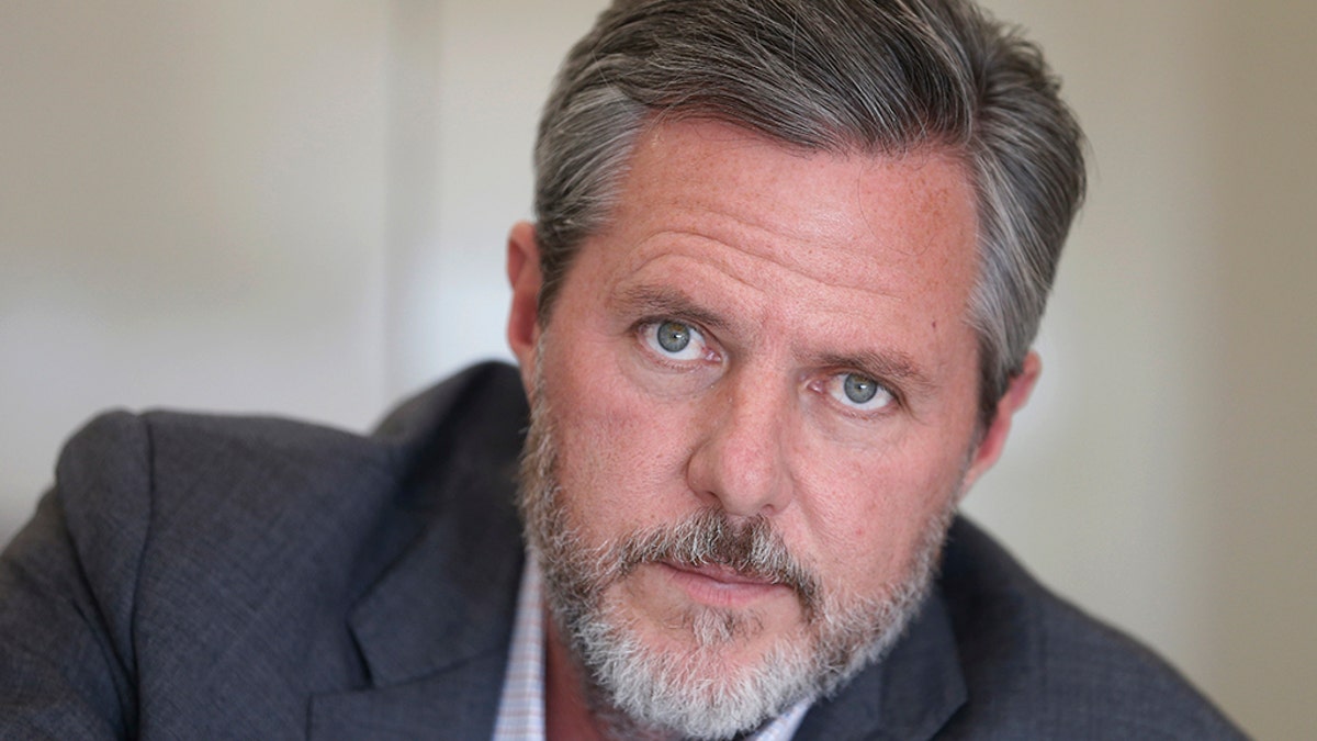 Former Liberty University president Jerry Falwell Jr., poses during an interview in his offices at the school in Lynchburg, Va on Nov. 16, 2016. (AP Photo/Steve Helber, File)