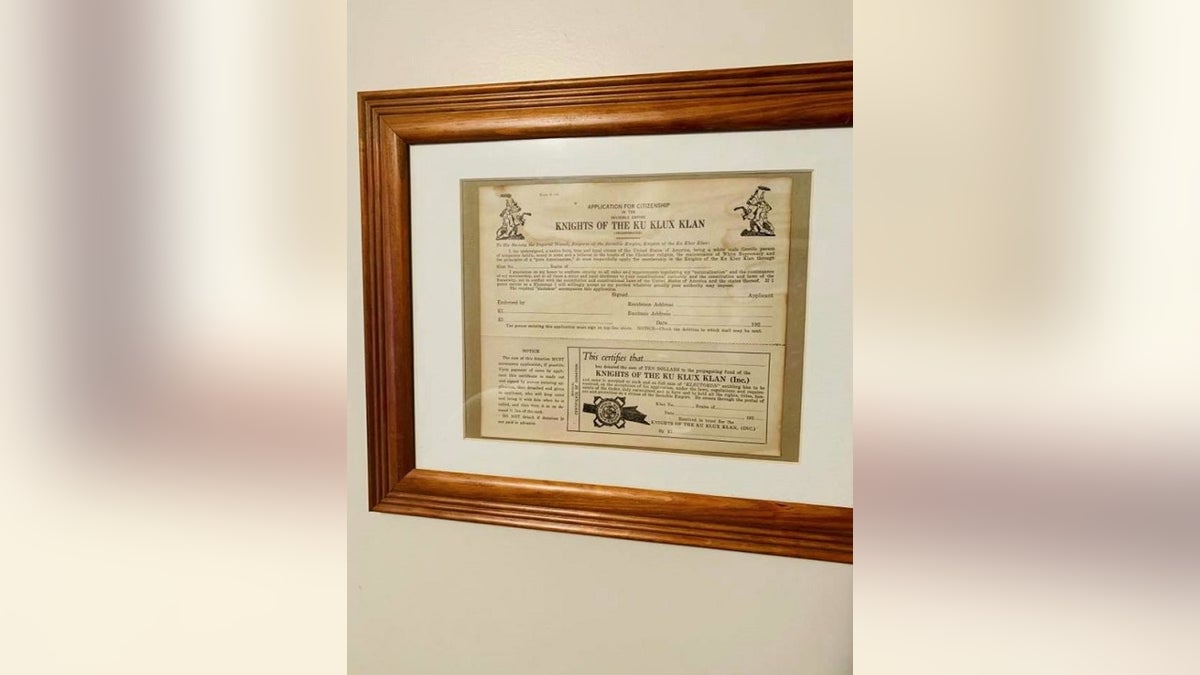 Rob Mathis said he found a framed Ku Klux Klax application displayed in the home of Muskegon Police Officer Charles Anderson during a real estate tour. 
