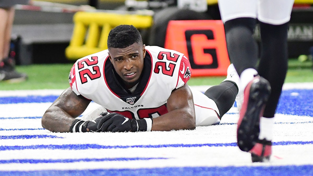 Atlanta Falcons safety Keanu Neal (22) lays injured in the end zone in the second half against the Indianapolis Colts at Lucas Oil Stadium.