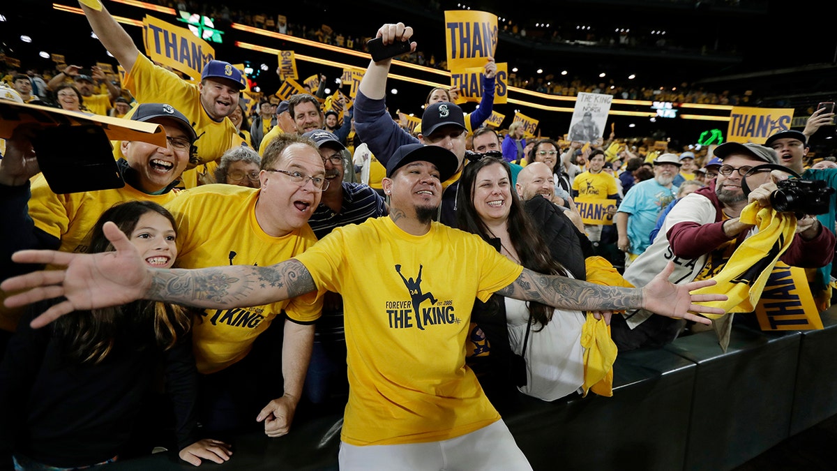 Seattle Mariners starting pitcher Felix Hernandez poses for photos with fans following the team's baseball game against the Oakland Athletics, Thursday, Sept. 26, 2019, in Seattle. The Athletics won 3-1. (AP Photo/Ted S. Warren)