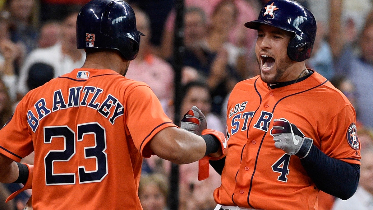 Houston Astros' George Springer, right, celebrates his two-run home run off Los Angeles Angels relief pitcher Jose Rodriguez with Michael Brantley during the second inning of a baseball game Sunday, Sept. 22, 2019, in Houston. (AP Photo/Eric Christian Smith)