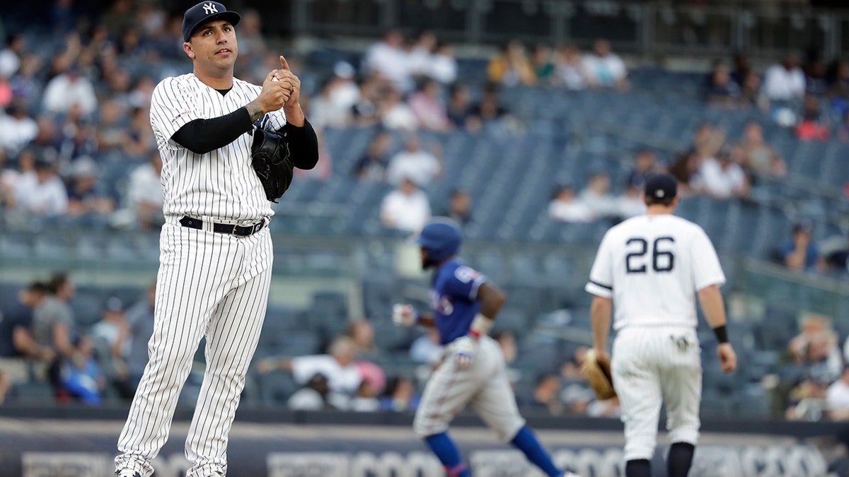 New York Yankees pitcher Nestor Cortes Jr., left, reacts after giving up a three-run home run to Texas Rangers' Delino DeShields during the eighth inning of a baseball game Monday, Sept. 2, 2019, in New York. (AP Photo/Adam Hunger)