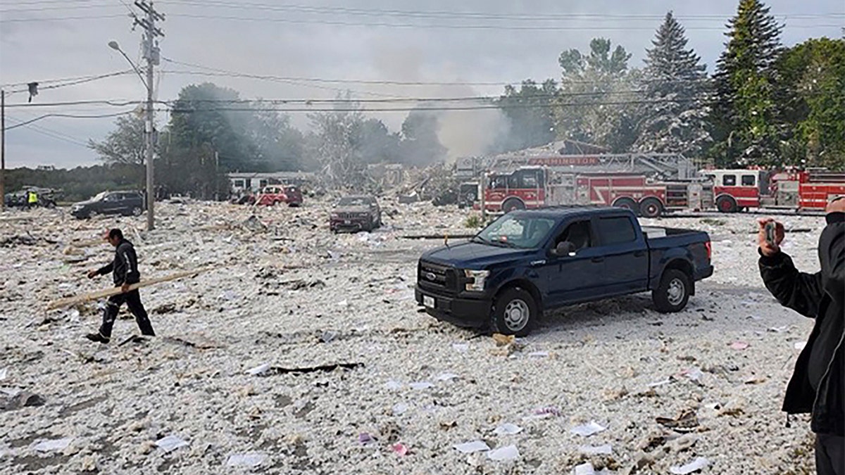 A man working at the scene of the deadly propane explosion Monday. (Jacob Gage via AP)