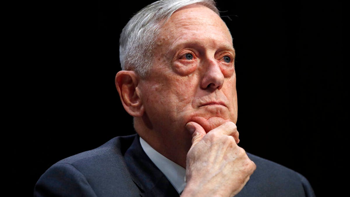 FILE - In this April 26, 2018, file photo, Defense Secretary Jim Mattis listens to a question during a hearing on Capitol Hill in Washington. Mattis warns bitter political divisions have pushed American society to the “breaking point” in his most extensive public remarks since he resigned in protest from the Trump administration. (AP Photo/Jacquelyn Martin, File)