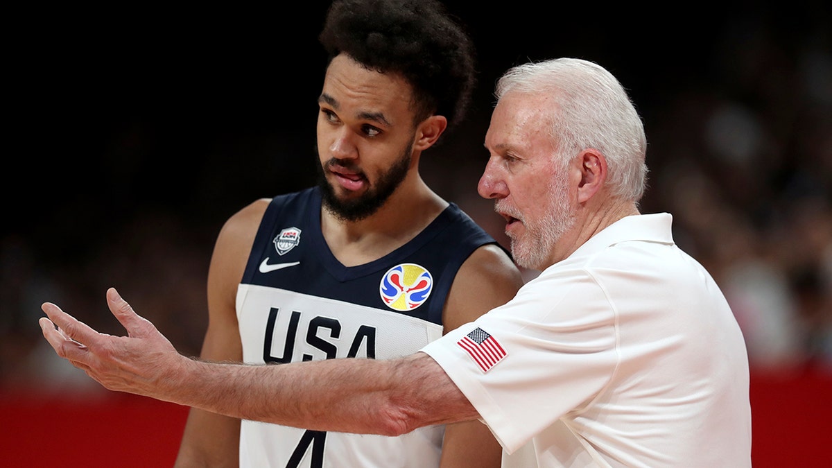 United States' coach Gregg Popovich, right instructs United States' Derrick White during a match against Brazil for the FIBA Basketball World Cup at the Shenzhen Bay Sports Center in Shenzhen on Monday, Sept. 9, 2019. (AP Photo/Ng Han Guan)