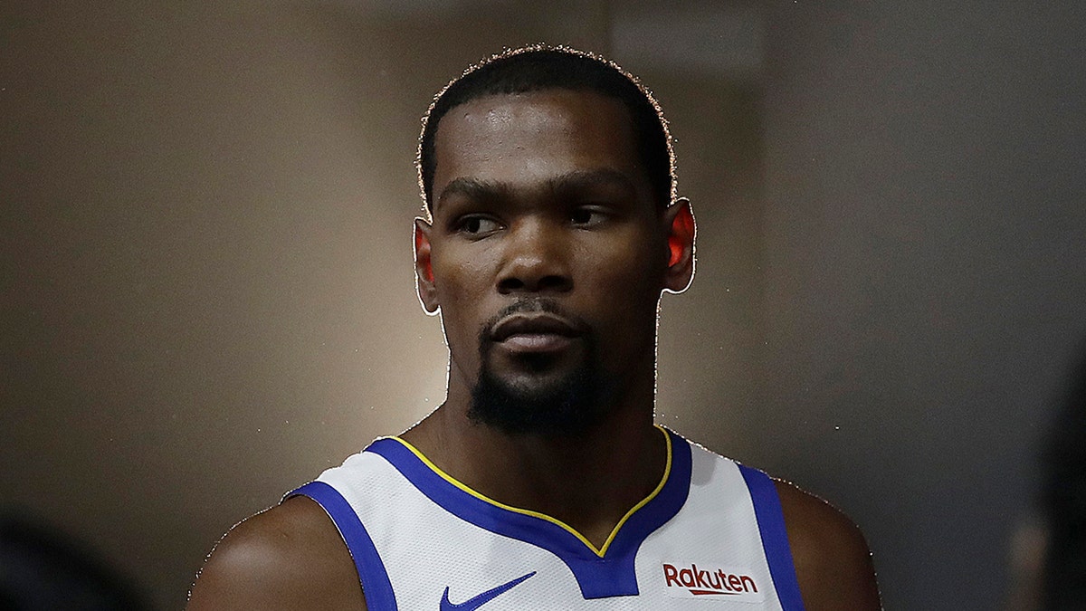 FILE - This is a Sept. 24, 2018, file photo showing then-Golden State Warriors' Kevin Durant posing for photos during media day at the NBA basketball team's practice facility in Oakland, Calif. (AP Photo/Jeff Chiu, File)