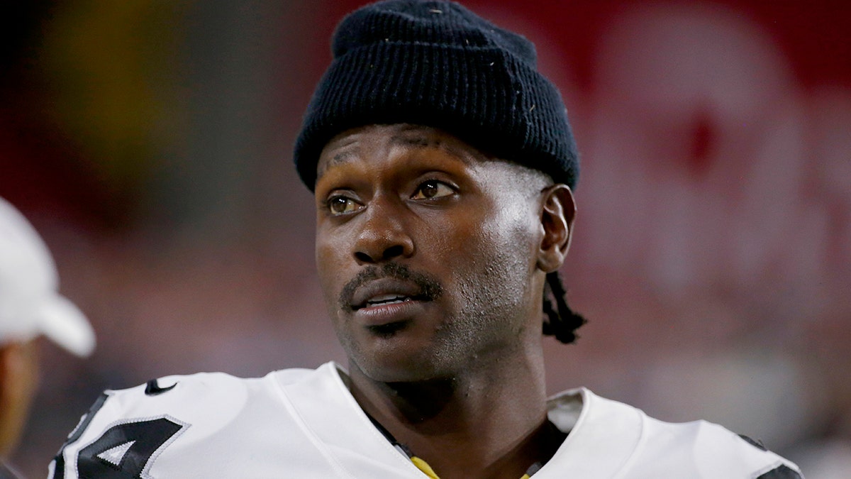 Oakland Raiders wide receiver Antonio Brown watches from the sidelines during the second half of the team's NFL preseason football game against the Arizona Cardinals in Glendale, Ariz. (AP Photo/Rick Scuteri, File)