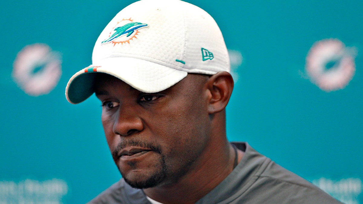 Miami Dolphins head coach Brian Flores takes questions from members of the media during preseason NFL football practice on Aug. 25, 2019, in Davie, Fla. (Carl Juste/Miami Herald via AP)