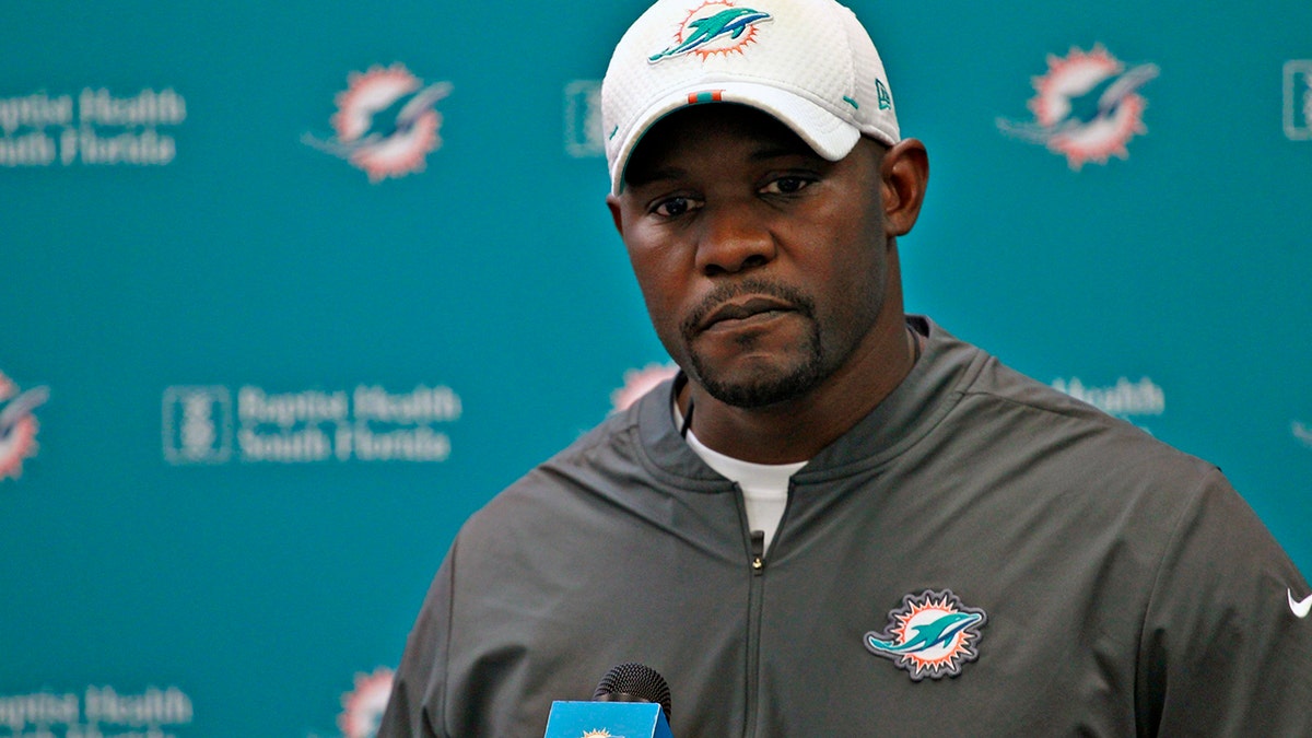 Miami Dolphins head coach Brian Flores takes questions from members of the media during NFL football practice, in Davie, Fla. (Carl Juste/Miami Herald via AP, File)