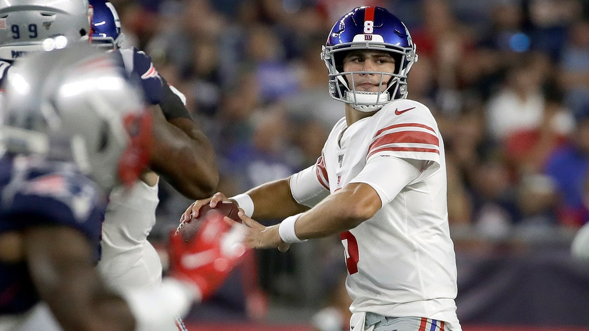 New York Giants quarterback Daniel Jones drops back to pass against the New England Patriots in the first half of an NFL preseason football game, Thursday, Aug. 29, 2019, in Foxborough, Mass. (AP Photo/Elise Amendola)