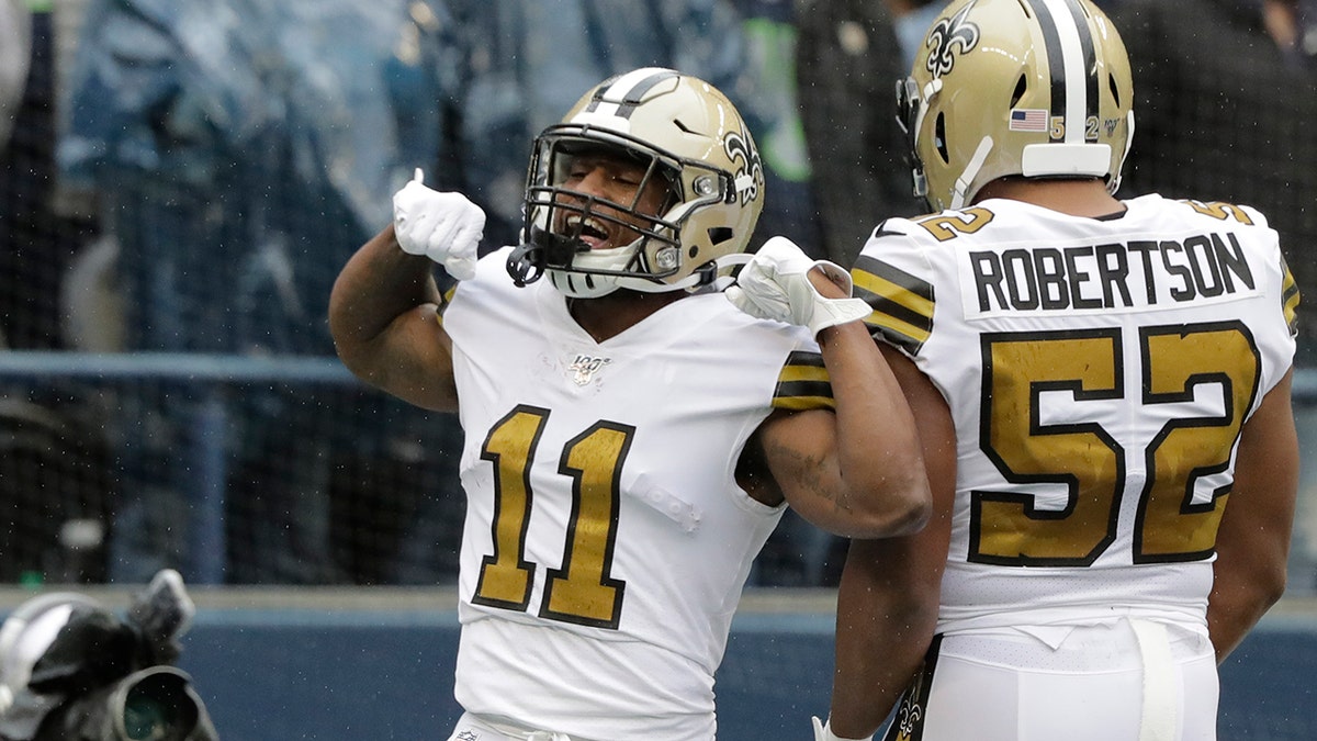 New Orleans Saints' Deonte Harris (11) celebrates his touchdown on a punt return against the Seattle Seahawks during the first half of an NFL football game Sunday, Sept. 22, 2019, in Seattle. (AP Photo/Ted S. Warren)