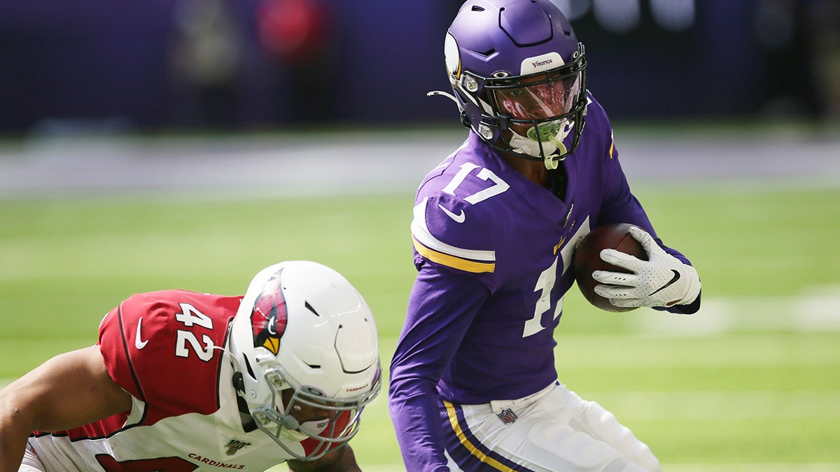 Minnesota Vikings wide receiver Dillon Mitchell (17) runs from Arizona Cardinals safety Jonathan Owens after making a reception during the second half of an NFL preseason football game, Saturday, Aug. 24, 2019, in Minneapolis. (AP Photo/Jim Mone)