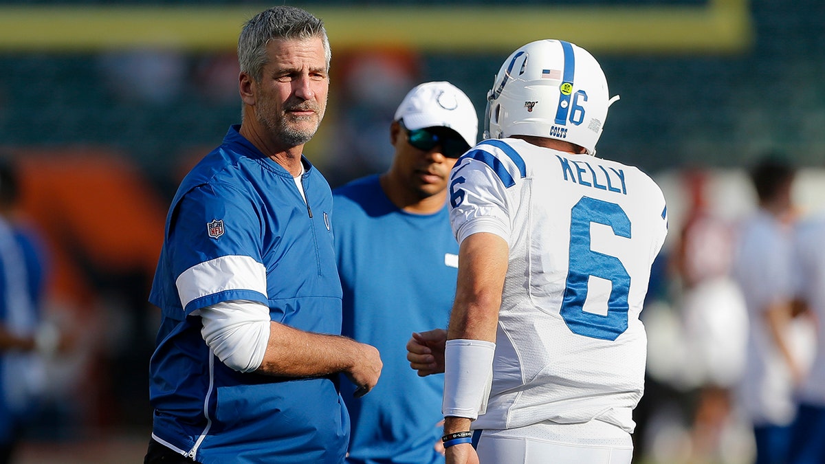 Indianapolis Colts coach Frank Reich, left, watches as players get ready for the team's NFL preseason football game against the Cincinnati Bengals, Thursday, Aug. 29, 2019, in Cincinnati. (AP Photo/Gary Landers)